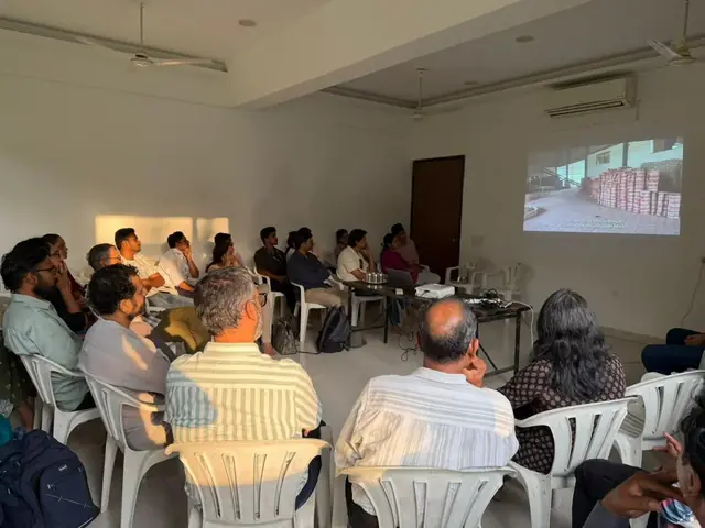 Attendees at the U-CAN City Mixer in Pune hosted by Shelter Associates, watching a film screening with the Charles Correa Foundation and Nagari Short Films, May 2026